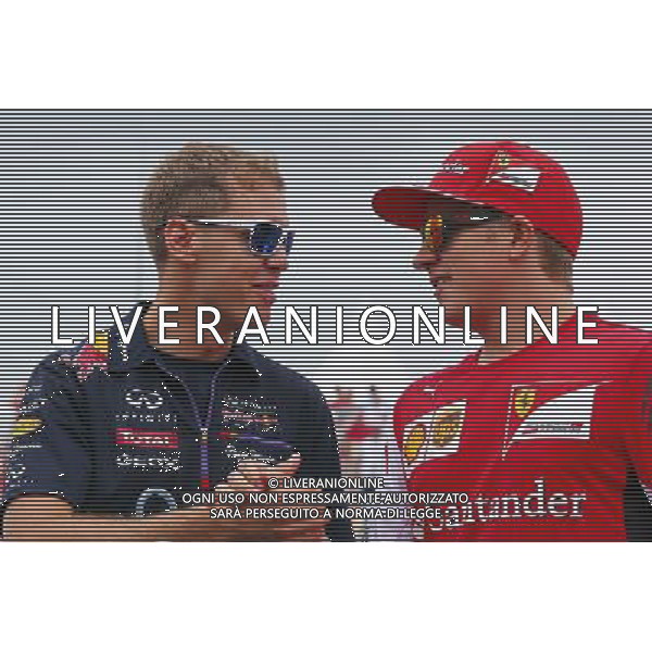 (L to R): Sebastian Vettel (GER) Red Bull Racing and Kimi Raikkonen (FIN) Ferrari on the drivers parade. 27.07.2014. Formula 1 World Championship, Rd 11, Hungarian Grand Prix, Budapest, Hungary, Race Day. - www.xpbimages.com, EMail: requests@xpbimages.com - copy of publication required for printed pictures. Every used picture is fee-liable. © Copyright: Batchelor / XPB Images AG ALDO LIVERANI SAS ONLY ITALY