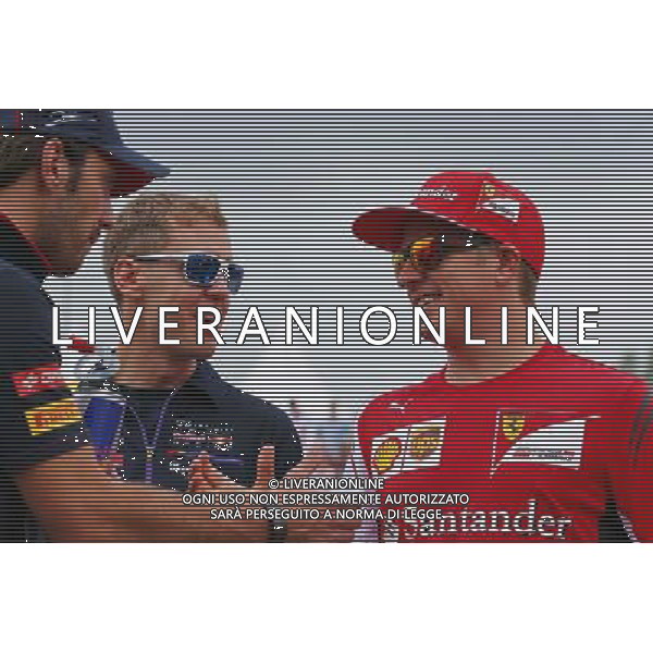 (L to R): Jean-Eric Vergne (FRA) Scuderia Toro Rosso; Sebastian Vettel (GER) Red Bull Racing; and Kimi Raikkonen (FIN) Ferrari on the drivers parade. 27.07.2014. Formula 1 World Championship, Rd 11, Hungarian Grand Prix, Budapest, Hungary, Race Day. - www.xpbimages.com, EMail: requests@xpbimages.com - copy of publication required for printed pictures. Every used picture is fee-liable. © Copyright: Batchelor / XPB Images AG ALDO LIVERANI SAS ONLY ITALY