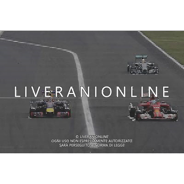 Daniel Ricciardo (AUS), Red Bull Racing overtakes Fernando Alonso (ESP), Scuderia Ferrari Sahara Force India Formula One Team the lead 27.07.2014. Formula 1 World Championship, Rd 11, Hungarian Grand Prix, Budapest, Hungary, Race Day. - www.xpbimages.com, EMail: requests@xpbimages.com - copy of publication required for printed pictures. Every used picture is fee-liable. © Copyright: Charniaux / XPB Images AG ALDO LIVERANI SAS ONLY ITALY