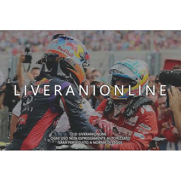 (L to R): Race winner Daniel Ricciardo (AUS) Red Bull Racing celebrates with second placed Fernando Alonso (ESP) Ferrari in parc ferme. 27.07.2014. Formula 1 World Championship, Rd 11, Hungarian Grand Prix, Budapest, Hungary, Race Day. - www.xpbimages.com, EMail: requests@xpbimages.com - copy of publication required for printed pictures. Every used picture is fee-liable. © Copyright: Moy / XPB Images AG ALDO LIVERANI SAS ONLY ITALY