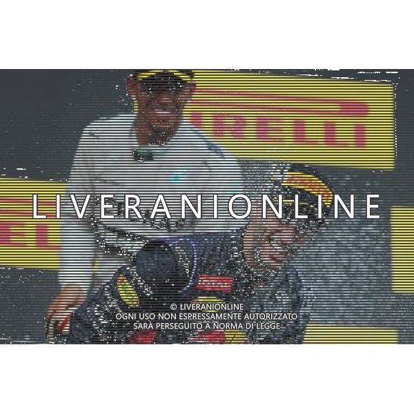 Race winner Daniel Ricciardo (AUS) Red Bull Racing celebrates with Lewis Hamilton (GBR) Mercedes AMG F1 and the champagne on the podium. 27.07.2014. Formula 1 World Championship, Rd 11, Hungarian Grand Prix, Budapest, Hungary, Race Day. - www.xpbimages.com, EMail: requests@xpbimages.com - copy of publication required for printed pictures. Every used picture is fee-liable. © Copyright: Moy / XPB Images AG ALDO LIVERANI SAS ONLY ITALY