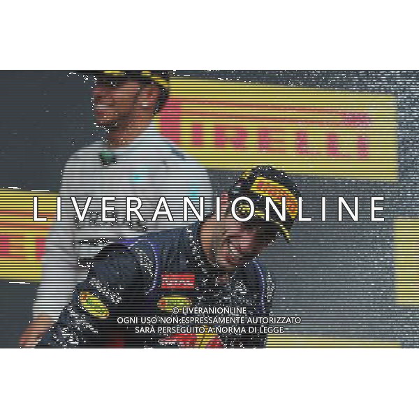 Race winner Daniel Ricciardo (AUS) Red Bull Racing celebrates with Lewis Hamilton (GBR) Mercedes AMG F1 and the champagne on the podium. 27.07.2014. Formula 1 World Championship, Rd 11, Hungarian Grand Prix, Budapest, Hungary, Race Day. - www.xpbimages.com, EMail: requests@xpbimages.com - copy of publication required for printed pictures. Every used picture is fee-liable. © Copyright: Moy / XPB Images AG ALDO LIVERANI SAS ONLY ITALY