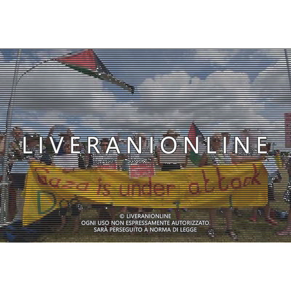 Malmesbury, UK, 27/07/2014 : Gazza Protest at WOMAD - World of Music, Arts and Dance. A small protest was held in the main arena in the Sunday morning where the names of Palestinians killed in the conflict was read out . ©PHOTOSHOT/Agenzia Aldo Liverani sas - ITALY ONLY - EDITORIAL USE ONLY