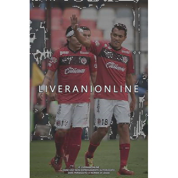 (140727) -- MEXICO CITY, July 27, 2014 () -- Xolos\' Juan Arango (R) celebrates after scoring during the match of the MX League Opening Tournament against America, held at Azteca Stadium in Mexico City, capital of Mexico, on July 26, 2014. (/Pedro Mera) (vf) (fnc) ©PHOTOSHOT/Agenzia Aldo Liverani sas - ITALY ONLY - EDITORIAL USE ONLY - AMERICA Vs XOLOS partita di apertura del torneo MX League Campionato messicano, presso Azteca Stadium di Citta\' del Messico 26 luglio 2014