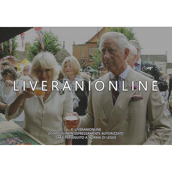 (a) Camilla Duchess of Cornwall and Prince Charles enjoy some beer tasting during a visit to the market town of Oakham Prince of Wales and Duchess of Cornwall visits Rutland, Britain - 28 Jul 2014 ©photoshot/Agenzia Aldo Liverani sas - ITALY ONLY - EDITORIAL USE ONLY - REALI INGLESI: Il Principe Carlo d\'inghilterra e la moglie Camilla Duchessa di Cornovaglia in visita ufficiale alla citta\' mercato di Oakham Rutland, Regno Unito - 28 luglio 2014