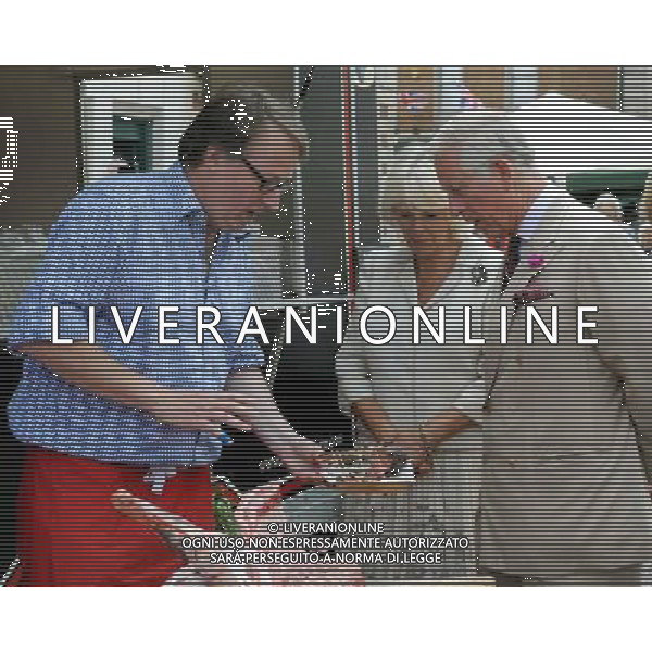 (l) Camilla Duchess of Cornwall and Prince Charles during a visit to the market town of Oakham Prince of Wales and Duchess of Cornwall visits Rutland, Britain - 28 Jul 2014 ©photoshot/Agenzia Aldo Liverani sas - ITALY ONLY - EDITORIAL USE ONLY - REALI INGLESI: Il Principe Carlo d\'inghilterra e la moglie Camilla Duchessa di Cornovaglia in visita ufficiale alla citta\' mercato di Oakham Rutland, Regno Unito - 28 luglio 2014