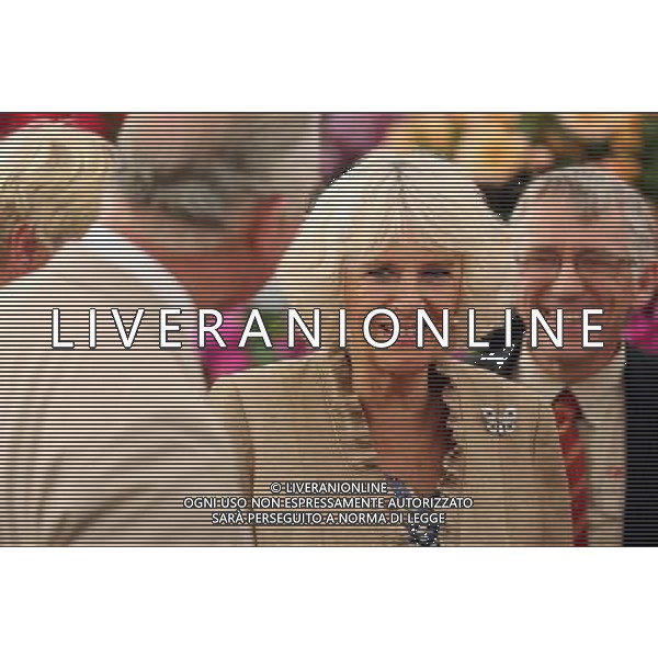 The Prince of Wales and the Duchess of Cornwall looks at exhibits during their visit to the Sandringham flower show held on the Royal Estate in Norfolk. ©photoshot/Agenzia Aldo Liverani sas - ITALY ONLY - REALI INGLESI: Camilla Duchessa di Cornovaglia durante la sua visita alla mostra floreale Sandringham tenutasi sul Royal Estate a Norfolk.