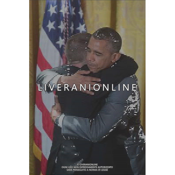 United States President Barack Obama, right, embraces restaurateur Tim Johnson after Obama mentioned him while speaking at an event titled \'A Celebration of Special Olympics and A Unified Generation\' to mark the anniversary of the Special Olympics in the East Room of the White House in Washington, D.C., U.S., on Thursday, July 31, 2014. Founded in 1968 by Mrs Kennedy Shriver, the Special Olympics movement has grown to more than 4.4 million athletes in 170 countries. ©PHOTOSHOT/Agenzia Aldo Liverani sas - ITALY ONLY - EDITORIAL USE ONLY - Il presidente americano Barack Obama al concerto per commemorare le Special Olympics nella Dining Room della Casa Bianca a Washington, DC, Stati Uniti, 31 luglio 2014