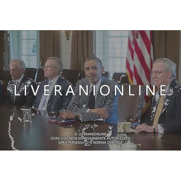 United States President Barack Obama holds a meeting with members of Congress on foreign policy on Thursday, July 31, 2014. The U.S. might move to limit derivatives trading and short-term loans with Russian companies if sanctions already imposed fail to sway President Putin of Russia to end support for rebels in eastern Ukraine. From left to right: U.S. Senator Bob Corker (Republican of Tennessee), Senator Reid, President Obama, and U.S. Senate Republican Leader Mitch McConnell (Republican of Kentucky). AG ALDO LIVERANI SAS ONLY ITALY