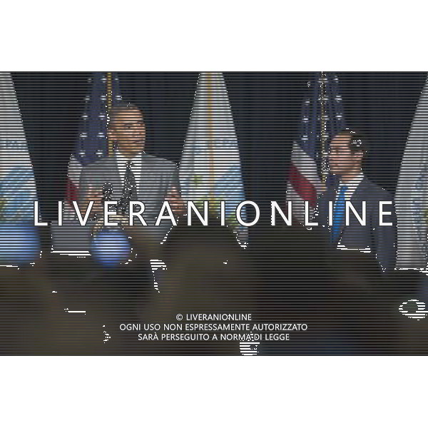 United States President Barack Obama, left, speaks to employees at the Department of Housing and Urban Development with Julian Castro, Secretary of U.S. Housing and Urban Development (HUD), in Washington, D.C., U.S., on Thursday, July 31, 2014. Castro, the former San Antonio, Texas mayor, was sworn in this week and will begin his duties on Monday, Aug. 4. AG ALDO LIVERANI SAS ONLY ITALY