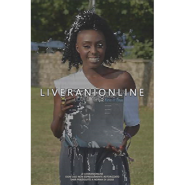 Laura Mvula with a copy of the classic album by Mile Davis - \'Kind of Blue\' at the Klipsch Audio presents Classic Album Sundays at Camp Bestival, at Lulworth Castle in Dorset, England. 2nd August 2014. ©photoshot/Agenzia Aldo Liverani sas - ITALY ONLY - EDITORIAL USE ONLY