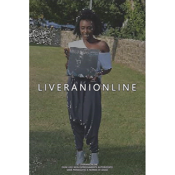 Laura Mvula with a copy of the classic album by Mile Davis - \'Kind of Blue\' at the Klipsch Audio presents Classic Album Sundays at Camp Bestival, at Lulworth Castle in Dorset, England. 2nd August 2014. ©photoshot/Agenzia Aldo Liverani sas - ITALY ONLY - EDITORIAL USE ONLY