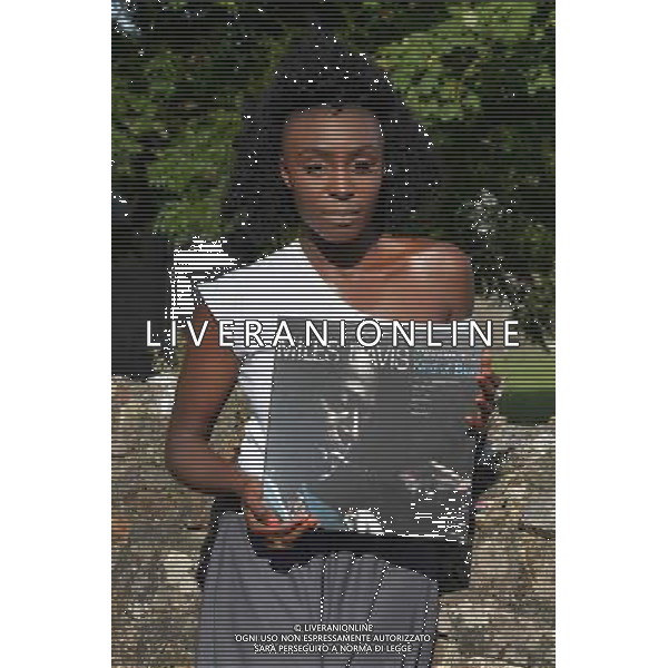 Laura Mvula with a copy of the classic album by Mile Davis - \'Kind of Blue\' at the Klipsch Audio presents Classic Album Sundays at Camp Bestival, at Lulworth Castle in Dorset, England. 2nd August 2014. ©photoshot/Agenzia Aldo Liverani sas - ITALY ONLY - EDITORIAL USE ONLY