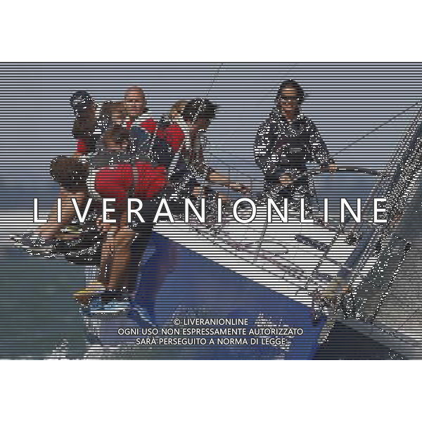 COWES, ENGLAND - AUGUST 03: Pippa Middleton with UKSA sailors during Aberdeen Asset Management Cowes Week on August 03, 2014 in Cowes, England. ©PHOTOSHOT/Agenzia Aldo Liverani sas - ITALY ONLY - EDITORIAL USE ONLY - Pippa Middleton con i marinai UKSA durante Aberdeen Asset Management Cowes Week 03 agosto 2014 in Inghilterra