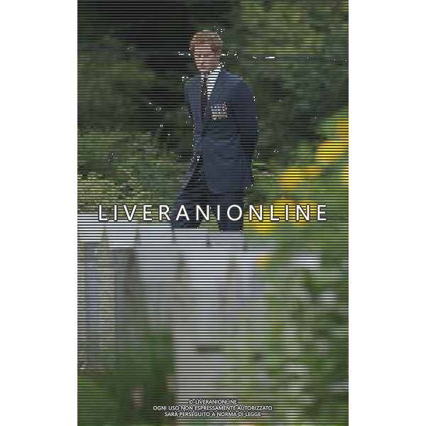 MONS, BELGIUM - AUGUST 04: Prince Harry looks at war graves at St Symphorien Military Cemetery on August 4, 2014 in Mons, Belgium. Monday 4th August marks the 100th Anniversary of Great Britain declaring war on Germany. In 1914 British Prime Minister Herbert Asquith announced at 11pm that Britain was to enter the war after Germany had violated Belgium\'s neutrality. The First World War or the Great War lasted until 11 November 1918 and is recognised as one of the deadliest historical conflicts with millions of casualties. A series of events commemorating the 100th Anniversary are taking place throughout the day. ©PHOTOSHOT/Agenzia Aldo Liverani sas - ITALY ONLY - EDITORIAL USE ONLY - REALI INGLESI: Il principe William d\'Inghilterra e la moglie Kate Duchessa di Cambridge e il principe Harry al St Symphorien cimitero militare a Mons, Belgio 4 agosto 2014 nel 100mo Anniversario della Grande guerra