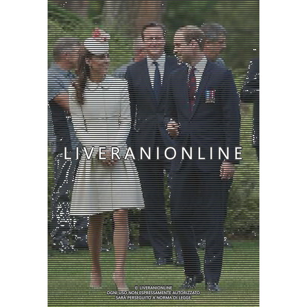 MONS, BELGIUM - AUGUST 04: Catherine, Duchess of Cambridge, Prince William, Duke of Cambridge and Prime Minister David Cameron walk through war graves at St Symphorien Military Cemetery on August 4, 2014 in Mons, Belgium. Monday 4th August marks the 100th Anniversary of Great Britain declaring war on Germany. In 1914 British Prime Minister Herbert Asquith announced at 11pm that Britain was to enter the war after Germany had violated Belgium\'s neutrality. The First World War or the Great War lasted until 11 November 1918 and is recognised as one of the deadliest historical conflicts with millions of casualties. A series of events commemorating the 100th Anniversary are taking place throughout the day. ©PHOTOSHOT/Agenzia Aldo Liverani sas - ITALY ONLY - EDITORIAL USE ONLY - REALI INGLESI: Il principe William d\'Inghilterra e la moglie Kate Duchessa di Cambridge e il principe Harry al St Symphorien cimitero militare a Mons, Belgio 4 agosto 2014 nel 100mo Anniversario della Grande guerra