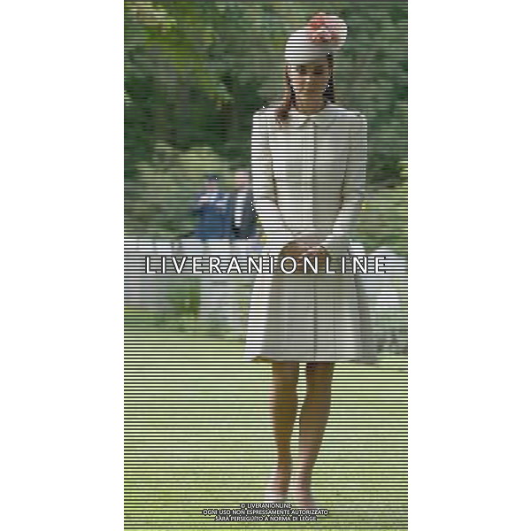 MONS, BELGIUM - AUGUST 04: Catherine, Duchess of Cambridge looks at war graves at St Symphorien Military Cemetery on August 4, 2014 in Mons, Belgium. Monday 4th August marks the 100th Anniversary of Great Britain declaring war on Germany. In 1914 British Prime Minister Herbert Asquith announced at 11pm that Britain was to enter the war after Germany had violated Belgium\'s neutrality. The First World War or the Great War lasted until 11 November 1918 and is recognised as one of the deadliest historical conflicts with millions of casualties. A series of events commemorating the 100th Anniversary are taking place throughout the day. ©PHOTOSHOT/Agenzia Aldo Liverani sas - ITALY ONLY - EDITORIAL USE ONLY - REALI INGLESI: Il principe William d\'Inghilterra e la moglie Kate Duchessa di Cambridge e il principe Harry al St Symphorien cimitero militare a Mons, Belgio 4 agosto 2014 nel 100mo Anniversario della Grande guerra
