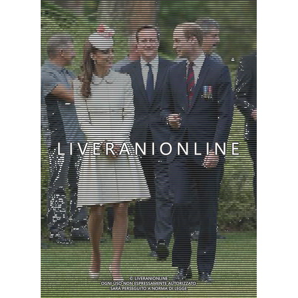 MONS, BELGIUM - AUGUST 04: Catherine, Duchess of Cambridge , Prince William, Duke of Cambridge and Prime Minister David Cameron walk through war graves at St Symphorien Military Cemetery on August 4, 2014 in Mons, Belgium. Monday 4th August marks the 100th Anniversary of Great Britain declaring war on Germany. In 1914 British Prime Minister Herbert Asquith announced at 11pm that Britain was to enter the war after Germany had violated Belgium\'s neutrality. The First World War or the Great War lasted until 11 November 1918 and is recognised as one of the deadliest historical conflicts with millions of casualties. A series of events commemorating the 100th Anniversary are taking place throughout the day. ©PHOTOSHOT/Agenzia Aldo Liverani sas - ITALY ONLY - EDITORIAL USE ONLY - REALI INGLESI: Il principe William d\'Inghilterra e la moglie Kate Duchessa di Cambridge e il principe Harry al St Symphorien cimitero militare a Mons, Belgio 4 agosto 2014 nel 100mo Anniversario della Grande guerra