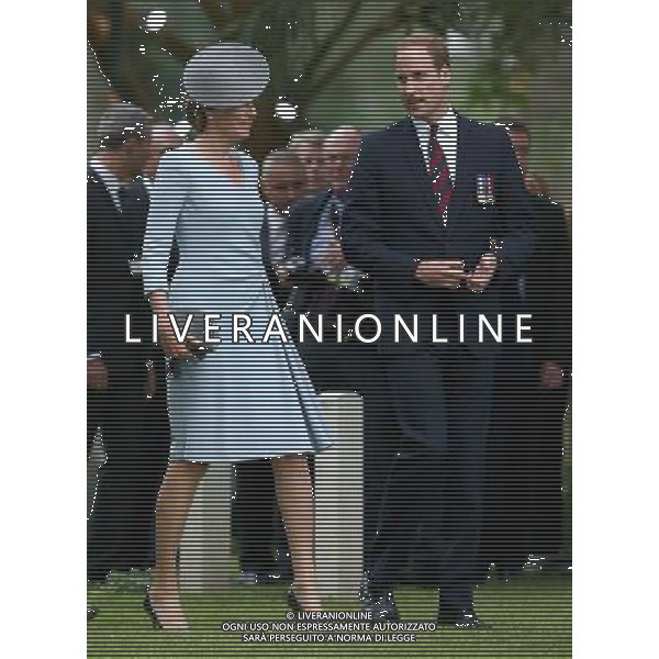 MONS, BELGIUM - AUGUST 04: Queen Matilde of Belgium and Prince William, Duke of Cambridge walk through war graves at St Symphorien Military Cemetery on August 4, 2014 in Mons, Belgium. Monday 4th August marks the 100th Anniversary of Great Britain declaring war on Germany. In 1914 British Prime Minister Herbert Asquith announced at 11pm that Britain was to enter the war after Germany had violated Belgium\'s neutrality. The First World War or the Great War lasted until 11 November 1918 and is recognised as one of the deadliest historical conflicts with millions of casualties. A series of events commemorating the 100th Anniversary are taking place throughout the day. ©PHOTOSHOT/Agenzia Aldo Liverani sas - ITALY ONLY - EDITORIAL USE ONLY - REALI INGLESI: Il principe William d\'Inghilterra e la moglie Kate Duchessa di Cambridge e il principe Harry al St Symphorien cimitero militare a Mons, Belgio 4 agosto 2014 nel 100mo Anniversario della Grande guerra
