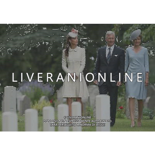 MONS, BELGIUM - AUGUST 04: Catherine, Duchess of Cambridge walks with King Philippe of Belgium and Queen Matilde of Belgium past war graves at St Symphorien Military Cemetery on August 4, 2014 in Mons, Belgium. Monday 4th August marks the 100th Anniversary of Great Britain declaring war on Germany. In 1914 British Prime Minister Herbert Asquith announced at 11pm that Britain was to enter the war after Germany had violated Belgium\'s neutrality. The First World War or the Great War lasted until 11 November 1918 and is recognised as one of the deadliest historical conflicts with millions of casualties. A series of events commemorating the 100th Anniversary are taking place throughout the day. ©PHOTOSHOT/Agenzia Aldo Liverani sas - ITALY ONLY - EDITORIAL USE ONLY - REALI INGLESI: Il principe William d\'Inghilterra e la moglie Kate Duchessa di Cambridge e il principe Harry al St Symphorien cimitero militare a Mons, Belgio 4 agosto 2014 nel 100mo Anniversario della Grande guerra