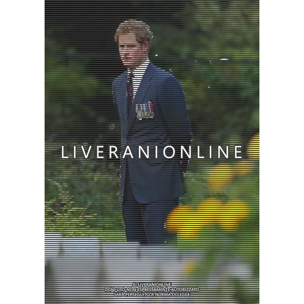 MONS, BELGIUM - AUGUST 04: Prince Harry looks at war graves at St Symphorien Military Cemetery on August 4, 2014 in Mons, Belgium. Monday 4th August marks the 100th Anniversary of Great Britain declaring war on Germany. In 1914 British Prime Minister Herbert Asquith announced at 11pm that Britain was to enter the war after Germany had violated Belgium\'s neutrality. The First World War or the Great War lasted until 11 November 1918 and is recognised as one of the deadliest historical conflicts with millions of casualties. A series of events commemorating the 100th Anniversary are taking place throughout the day. ©PHOTOSHOT/Agenzia Aldo Liverani sas - ITALY ONLY - EDITORIAL USE ONLY - REALI INGLESI: Il principe William d\'Inghilterra e la moglie Kate Duchessa di Cambridge e il principe Harry al St Symphorien cimitero militare a Mons, Belgio 4 agosto 2014 nel 100mo Anniversario della Grande guerra