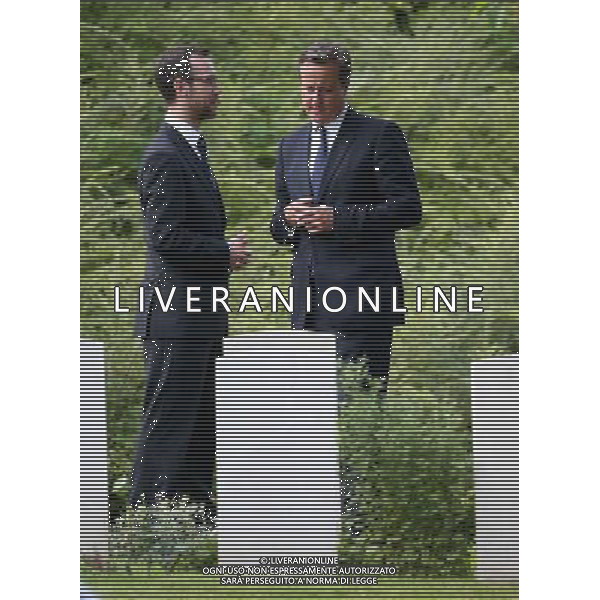 MONS, BELGIUM - AUGUST 04: Prime Minister David Cameron looks at war graves at St Symphorien Military Cemetery on August 4, 2014 in Mons, Belgium. Monday 4th August marks the 100th Anniversary of Great Britain declaring war on Germany. In 1914 British Prime Minister Herbert Asquith announced at 11pm that Britain was to enter the war after Germany had violated Belgium\'s neutrality. The First World War or the Great War lasted until 11 November 1918 and is recognised as one of the deadliest historical conflicts with millions of casualties. A series of events commemorating the 100th Anniversary are taking place throughout the day. ©PHOTOSHOT/Agenzia Aldo Liverani sas - ITALY ONLY - EDITORIAL USE ONLY - REALI INGLESI: Il principe William d\'Inghilterra e la moglie Kate Duchessa di Cambridge e il principe Harry al St Symphorien cimitero militare a Mons, Belgio 4 agosto 2014 nel 100mo Anniversario della Grande guerra