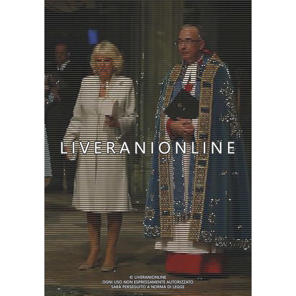 Camilla, Duchess of Cornwall, left, stands with Dean of Westminster the Reverend John Hall, as she attends a candlelit vigil and prayer service to commemorate the centenary of the outbreak of the First World War at Westminster Abbey in London, Monday, Aug. 4, 2014. (AP Photo/Sang Tan, Pool) ©PHOTOSHOT/Agenzia Aldo Liverani sas - ITALY ONLY - EDITORIAL USE ONLY - REALI INGLESI: Membri della famiglia reale durante la commemorazione del centenario dello scoppio della prima guerra mondiale a Londra, Lunedi, 4 agosto 2014.