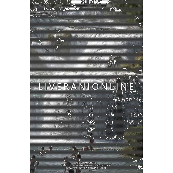 (140805) -- SKRADIN, Aug. 5, 2014 () -- People play with water in front of the Skradinski Buk waterfall at the Krka National Park, one of Croatia\'s best-known nature sites and tourist destinations, in Skradin near Sibenik, southern Croatia, Aug. 4, 2014. (/Miso Lisanin) ©PHOTOSHOT/Agenzia Aldo Liverani sas - ITALY ONLY - EDITORIAL USE ONLY - Vedute della citta\' turistica sul Mar Adriatico nel sud della Croazia, 4 agosto, 2014