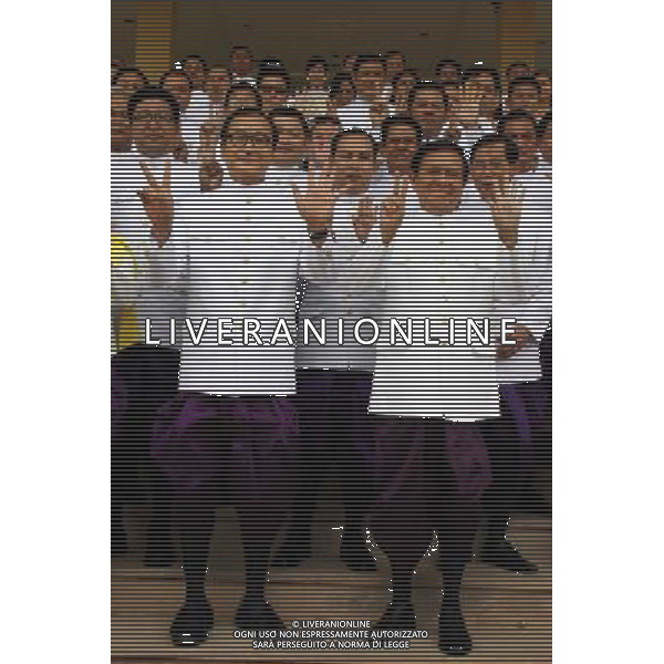(140805) -- PHNOM PENH, Aug. 5, 2014 () -- Sam Rainsy (L, front), president of the opposition Cambodia National Rescue Party (CNRP), and his deputy Kem Sokha (R, front), along with other party\'s lawmakers, pose for photographs at the parliament in advance of their swearing-in at the Royal Palace in Phnom Penh, Cambodia, Aug. 5, 2014. All fifty-five politicians from the opposition Cambodia National Rescue Party (CNRP) took their oaths as parliamentarians on Tuesday afternoon after boycotting the parliament for ten months against disputed election results in July last year. (/Sovannara) ©PHOTOSHOT/Agenzia Aldo Liverani sas - ITALY ONLY - EDITORIAL USE ONLY - Ceriminia di giuramento dei cinquantacinque politici da l\'opposizione come parlamentari dopo il boicottaggio del parlamento presso il Palazzo Reale di Phnom Penh, Cambogia, 5 agosto 2014