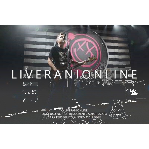 Mark Hoppus (foreground) and Travis Barker (Background) of American Pop Punk band Blink-182 performing at the first of two shows at Brixton Academy, London, England, UK on Wednesday 6th August 2014. AG ALDO LIVERANI SAS ONLY ITALY