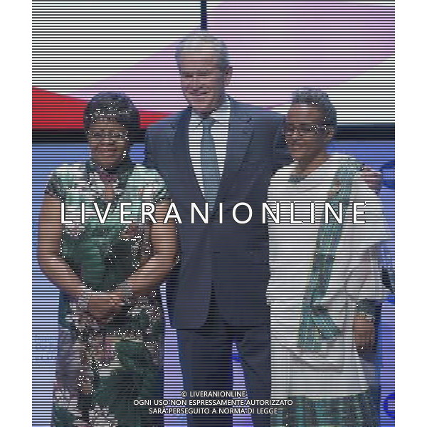 Former United States President George W. Bush, center, poses with Penehupifo Pohamba, first lady of the Republic of Namibia, left, and Roman Tesfaye, first lady of the Federal Democratic Republic of Ethiopia, right, as it was announced the Pink Ribbon Red Ribbon initiative would be expanded to include their countries at the \'Investing in our Future at the U.S. - Africa Leaders Summit at the John F. Kennedy Center for the Performing Arts in Washington, D.C. on Wednesday, August 6, 2014. AG ALDO LIVERANI SAS ONLY ITALY