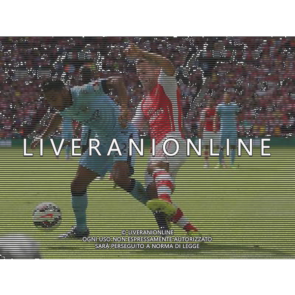 Manchester City\'s Ga‘l Clichy holds of Arsenal\'s Jack Wilshere Photographer Kieran Galvin/CameraSport Football Friendly - FA Community Shield - Arsenal v Manchester City - Sunday 10th August 2014 - Wembley - London © CameraSport - 43 Linden Ave. Countesthorpe. Leicester. England. LE8 5PG - Tel: +44 (0) 116 277 4147 - admin@camerasport.com - www.camerasport.com AG ALDO LIVERANI SAS ONLY ITALY