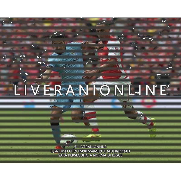 Manchester City\'s Jesœs Navas holds of Arsenal\'s Kieran Gibbs Photographer Kieran Galvin/CameraSport Football Friendly - FA Community Shield - Arsenal v Manchester City - Sunday 10th August 2014 - Wembley - London © CameraSport - 43 Linden Ave. Countesthorpe. Leicester. England. LE8 5PG - Tel: +44 (0) 116 277 4147 - admin@camerasport.com - www.camerasport.com AG ALDO LIVERANI SAS ONLY ITALY