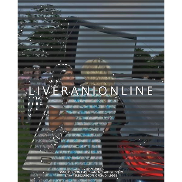  Danielle Armstrong and Jasmin Walia exchange a kiss at the Essex Drive-In Movie, Grease, Brentwood Essex Date ; 09/08/2014 AG ALDO LIVERANI SAS ONLY ITALY