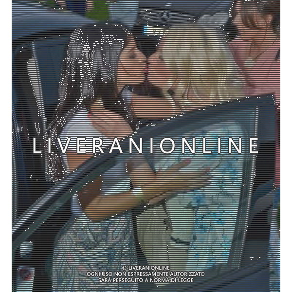  Danielle Armstrong and Jasmin Walia exchange a kiss at the Essex Drive-In Movie, Grease, Brentwood Essex Date ; 09/08/2014 AG ALDO LIVERANI SAS ONLY ITALY