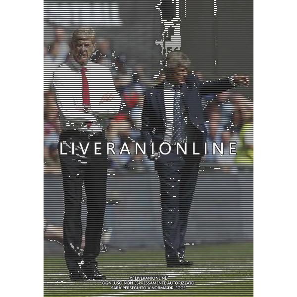 (140811) -- LONDON, Aug. 11, 2014 () -- Arsene Wenger (L), manager of Arsenal, looks on as Manuel Pellegrini, manager of Manchester City, gestures during the Community Shield match between Arsenal and Manchester City at Wembley Stadium in London, Britain on Aug. 10, 2014. Arsenal won 3-0. (/Wang Lili)(jyt) AG ALDO LIVERANI SAS ONLY ITALY