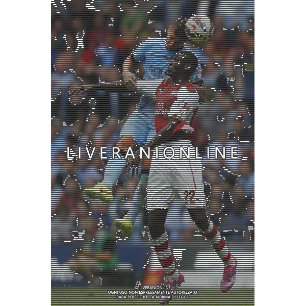 (140811) -- LONDON, Aug. 11, 2014 () -- Yaya Sanogo (R) of Arsenal heads the ball with Stevan Jovetic of Manchester City during the Community Shield match between Arsenal and Manchester City at Wembley Stadium in London, Britain on Aug. 10, 2014. Arsenal won 3-0. (/Wang Lili)(jyt) AG ALDO LIVERANI SAS ONLY ITALY