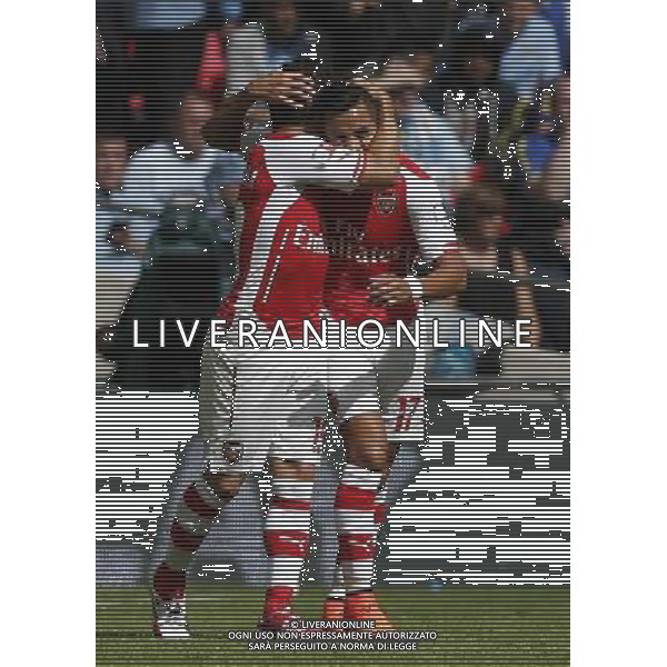 (140811) -- LONDON, Aug. 11, 2014 () -- Santi Cazorla (L) of Arsenal celebrates scoring with teammate Alexis Sanchez during the Community Shield match between Arsenal and Manchester City at Wembley Stadium in London, Britain on Aug. 10, 2014. Arsenal won 3-0. (/Wang Lili)(tjh) AG ALDO LIVERANI SAS ONLY ITALY