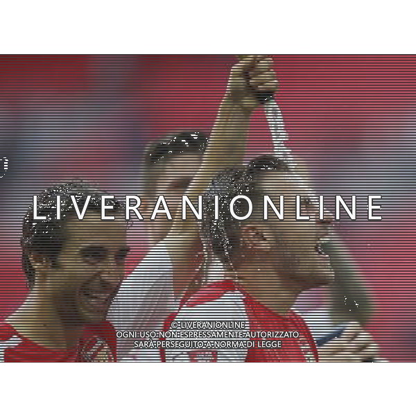 (140811) -- LONDON, Aug. 11, 2014 () -- Mathieu Flamini(L) of Arsenal celebrates by spraying champagne towards his teammate Aaron Ramsey after the Community Shield match between Arsenal and Manchester City at Wembley Stadium in London, Britain on Aug. 10, 2014. Arsenal won 3-0. (/Wang Lili)(by) AG ALDO LIVERANI SAS ONLY ITALY