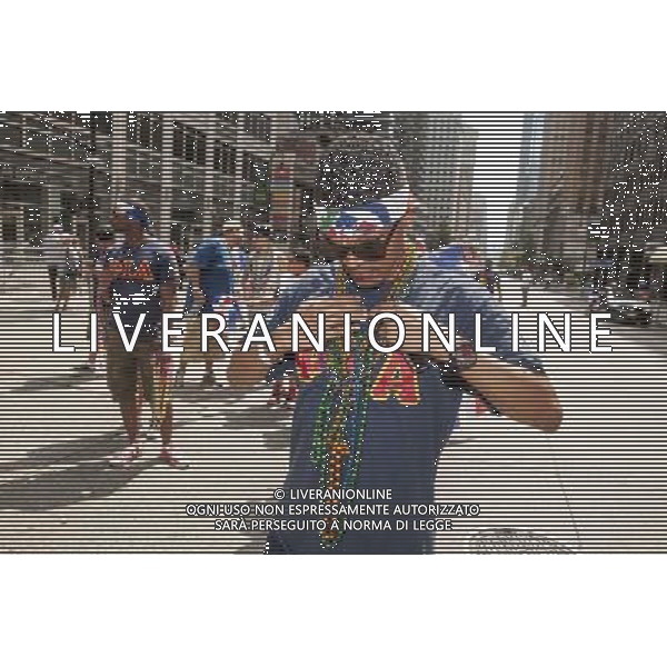 Hispanic fraternity member from Phi Iota Alpha adjusts his beads in the 33rd Annual Dominican Day Parade in New York on Sixth Avenue on Sunday, August 10, 2014. Politicians, flags and cultural pride were on display at the annual event. Over 6o0,000 people identifying themselves as as Dominicans live in the New York area and with beautiful weather it seem like almost all of them were on Sixth Avenue. ©PHOTOSHOT/Agenzia Aldo Liverani sas - ITALY ONLY - EDITORIAL USE ONLY - 33ma parata annuale nella giornata domenicana a New York, sulla Sixth Avenue, 10 agosto 2014