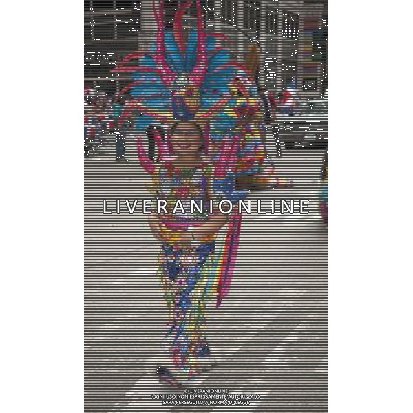 Costumed dancer from Santiago, Dominican Republic marches in the 33rd Annual Dominican Day Parade in New York on Sixth Avenue on Sunday, August 10, 2014. Politicians, flags and cultural pride were on display at the annual event. Over 6o0,000 people identifying themselves as as Dominicans live in the New York area and with beautiful weather it seem like almost all of them were on Sixth Avenue. ©PHOTOSHOT/Agenzia Aldo Liverani sas - ITALY ONLY - EDITORIAL USE ONLY - 33ma parata annuale nella giornata domenicana a New York, sulla Sixth Avenue, 10 agosto 2014