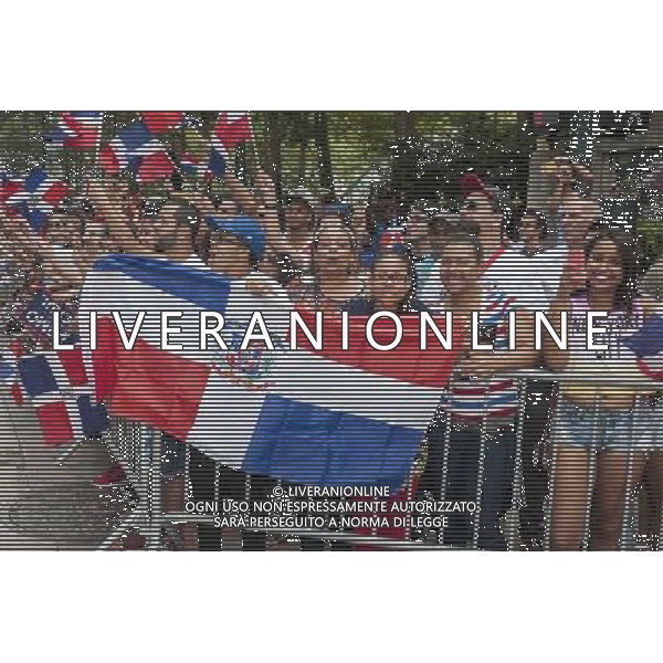 Thousands of Dominican-Americans and their friends and supporters march and view the 33rd Annual Dominican Day Parade in New York on Sixth Avenue on Sunday, August 10, 2014. Politicians, flags and cultural pride were on display at the annual event. Over 6o0,000 people identifying themselves as as Dominicans live in the New York area and with beautiful weather it seem like almost all of them were on Sixth Avenue. ©PHOTOSHOT/Agenzia Aldo Liverani sas - ITALY ONLY - EDITORIAL USE ONLY - 33ma parata annuale nella giornata domenicana a New York, sulla Sixth Avenue, 10 agosto 2014