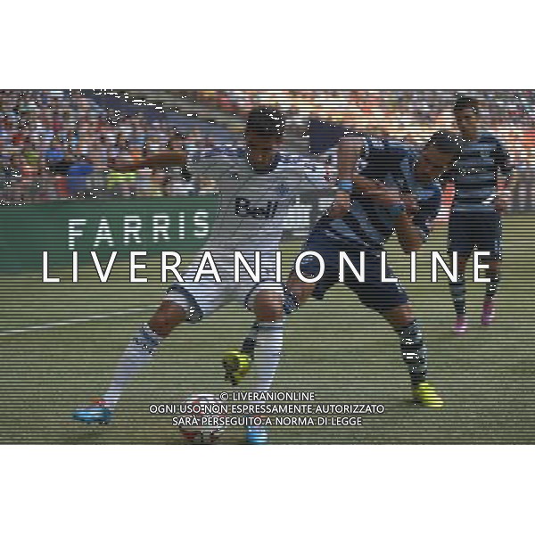 Vancouver Whitecaps\' Mehdi Ballouchy (L) vies with Sporting Kansas City\' Benny Feilhaber during their MLS soccer game on Aug.10, 2014 at BC Place in Vancouver, Canada. Vancouver Whitecaps defeated Sporting KC 2-0. ©PHOTOSHOT/Agenzia Aldo Liverani sas - ITALY ONLY - EDITORIAL USE ONLY