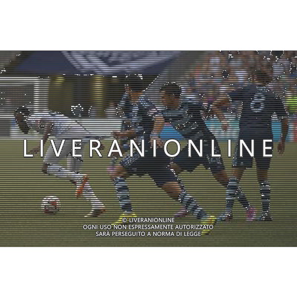 Vancouver Whitecaps\' Gershon Koffie (L) vies with Sporting Kansas City\' Mikey Lopez during their MLS soccer game on Aug.10, 2014 at BC Place in Vancouver, Canada. Vancouver Whitecaps defeated Sporting KC 2-0. ©PHOTOSHOT/Agenzia Aldo Liverani sas - ITALY ONLY - EDITORIAL USE ONLY