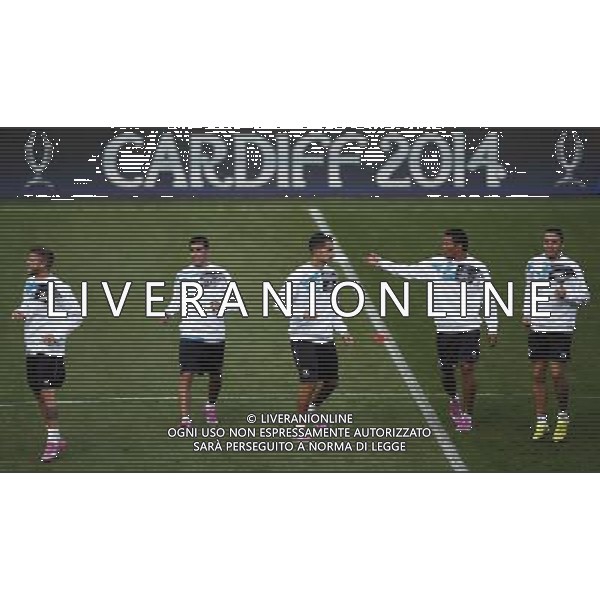 (140812) -- CARDIFF, Aug 12, 2014 () -- Players of Sevilla take a training session for the UEFA Super Cup match between Real Madrid and Sevilla at Cardiff City Stadium in Cardiff, Britain on Aug. 11, 2014. (/Wang Lili)(yqq) ©PHOTOSHOT/Agenzia Aldo Liverani sas - ITALY ONLY - EDITORIAL USE ONLY - Sessione di allenamento del Real Madrid e Siviglia che disputeranno la partita di Supercoppa UEFA al Cardiff City Stadium, Gran Bretagna il 11 agosto 2014