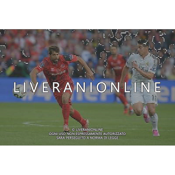 Sevilla\'s Jose Antonio Reyes battles with Real Madrid\'s James Rodriguez Photographer Ian Cook/CameraSport Football - UEFA Supercup - Real Madrid v Sevilla - Tuesday 12th August 2014 - Cardiff City Stadium - Cardiff © CameraSport - 43 Linden Ave. Countesthorpe. Leicester. England. LE8 5PG - Tel: +44 (0) 116 277 4147 - admin@camerasport.com - www.camerasport.com AG ALDO LIVERANI SAS ONLY ITALY