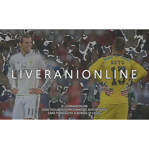 Real Madrid\'s Gareth Bale has a laugh with Sevilla\'s Beto Photographer Ian Cook/CameraSport Football - UEFA Supercup - Real Madrid v Sevilla - Tuesday 12th August 2014 - Cardiff City Stadium - Cardiff © CameraSport - 43 Linden Ave. Countesthorpe. Leicester. England. LE8 5PG - Tel: +44 (0) 116 277 4147 - admin@camerasport.com - www.camerasport.com AG ALDO LIVERANI SAS ONLY ITALY