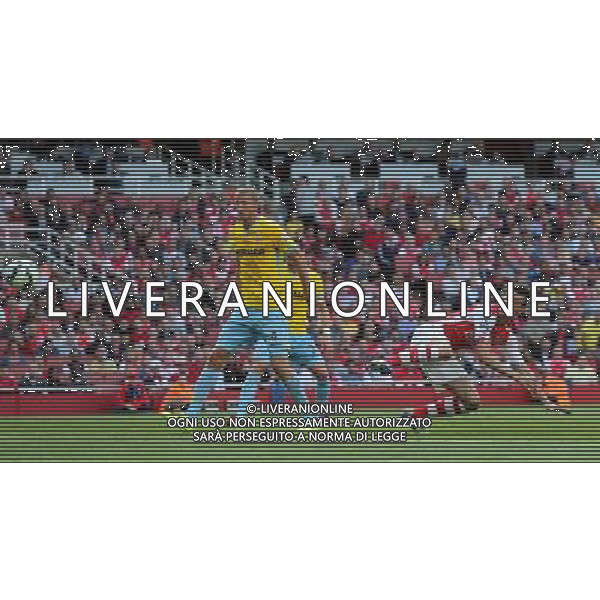 Arsenal\'s Laurent Koscielny scores Photographer Kieran Galvin/CameraSport Football - Barclays Premiership - Arsenal v Crystal Palace - Saturday 16th August 2014 - The Emirates Stadium - London © CameraSport - 43 Linden Ave. Countesthorpe. Leicester. England. LE8 5PG - Tel: +44 (0) 116 277 4147 - admin@camerasport.com - www.camerasport.com AG ALDO LIVERANI SAS ONLY ITALY