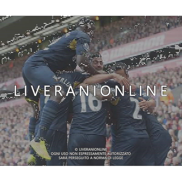 Southampton\'s Nathaniel Clyne (#2) is swamped by team-mates after scoring his sides equalising goal to make the score 1-1 Photographer Stephen White/CameraSport Football - Barclays Premiership - Liverpool v Southampton - Sunday 17th August 2014 - Anfield - Liverpool Â© CameraSport - 43 Linden Ave. Countesthorpe. Leicester. England. LE8 5PG - Tel: +44 (0) 116 277 4147 - admin@camerasport.com - www.camerasport.com AG ALDO LIVERANI SAS ONLY ITALY