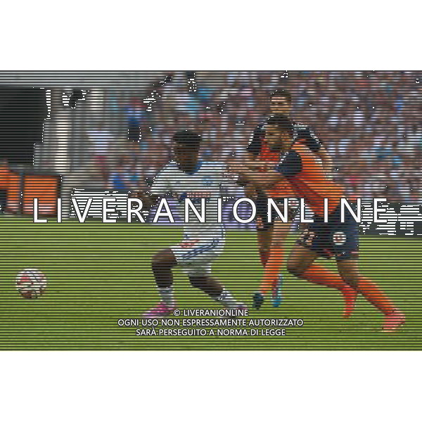 Michy BATSHUAYI / Abdelhamid EL KAOUTARI - 17.08.2014 - Marseille / Montpellier - 2eme journee de Ligue 1 - Photo : Gaston Petrelli / Icon Sport AG ALDO LIVERANI SAS ONLY ITALY